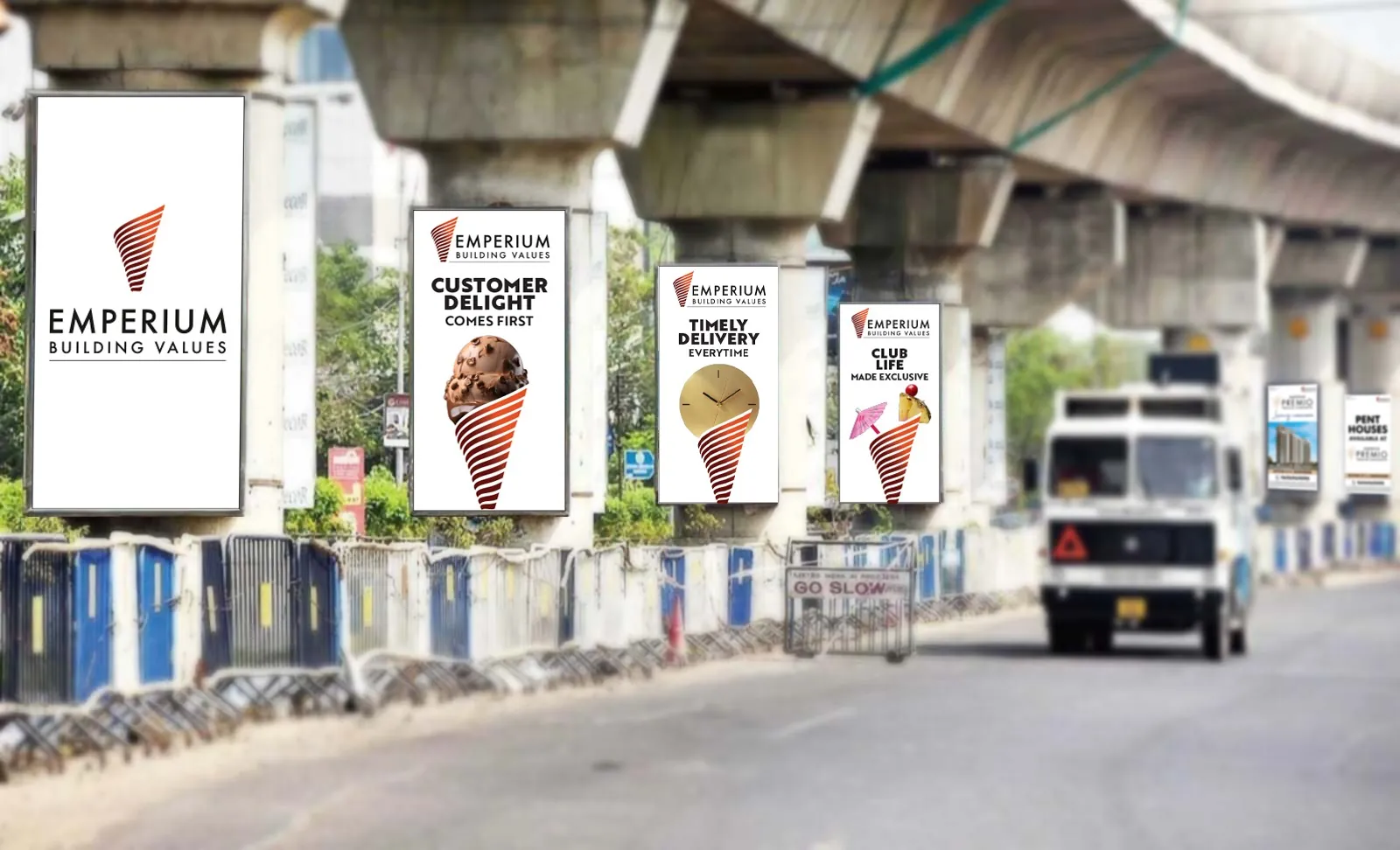 Emperium Building Values and Premio creatives on a row of metro pillars